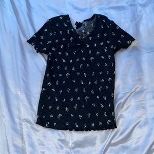 Dark blue tight fitting shirt with white flower prints from Art Class